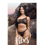 Another angle of the black mesh bralette and panty with studded elastic