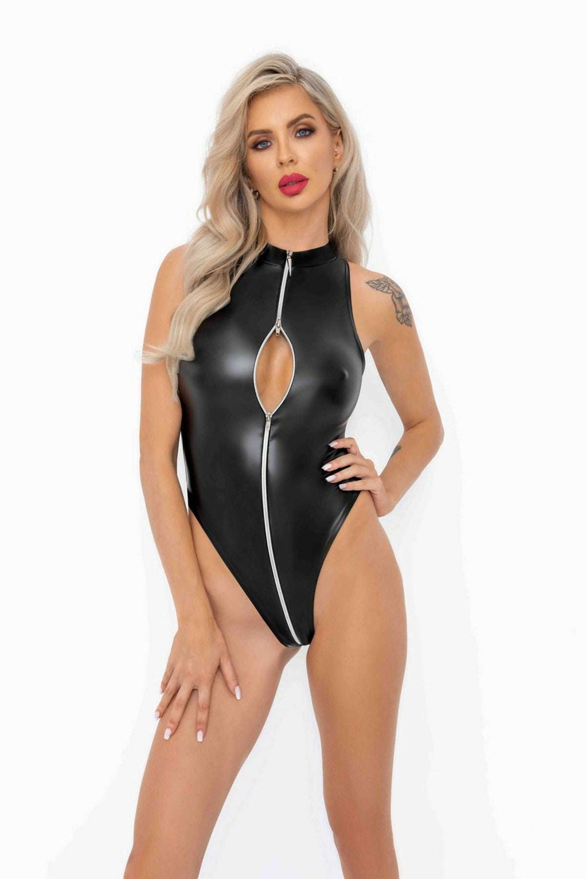 An alternate view of the black wetlook zip bodysuit, with a high-cut hemline