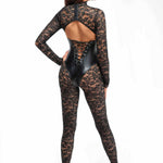 An alternate view of the Enigma black lace catsuit, with long elastic lace sleeves