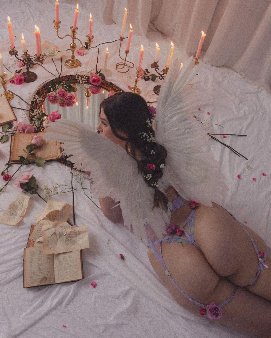 Lilac floral lingerie set with angel wings, roses and candlelight — erotic boudoir editorial at nympho life, photo by Bralettes and Brunch